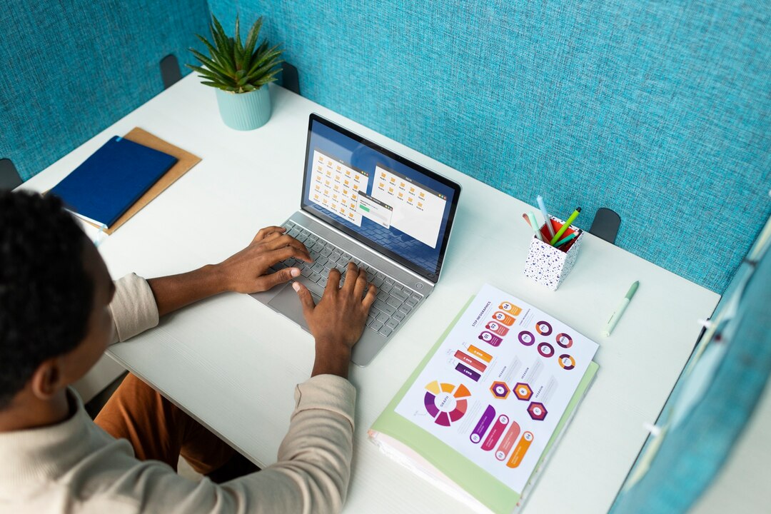 high-angle-woman-working-laptop_23-2149908209